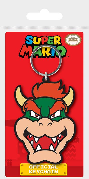 Soft PVC keychain of Bowser from Super Mario on a red card with 'Super Mario' branding.  Bowser's head is 2.75 inches from hair to chin and 2 inches wide from cheek to cheeky cheek.  Official Nintendo accessory from Nerd Imports.