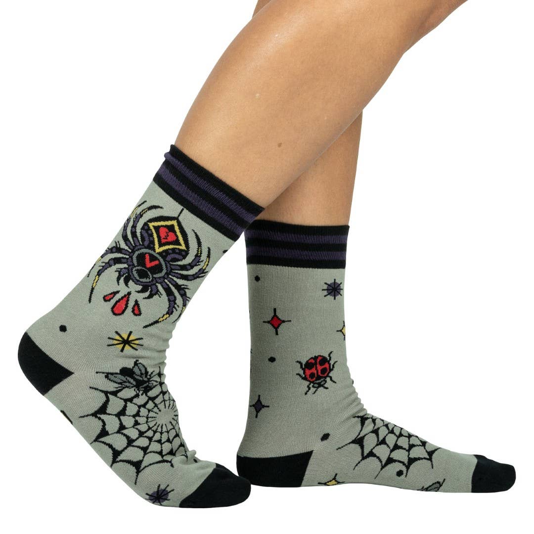 Widow's Web Crew Socks front view — gothic spider web design on dark novelty crew sock