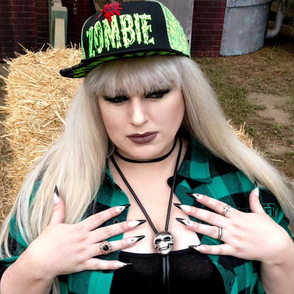Woman modeling our zombie bite snapbaack hat