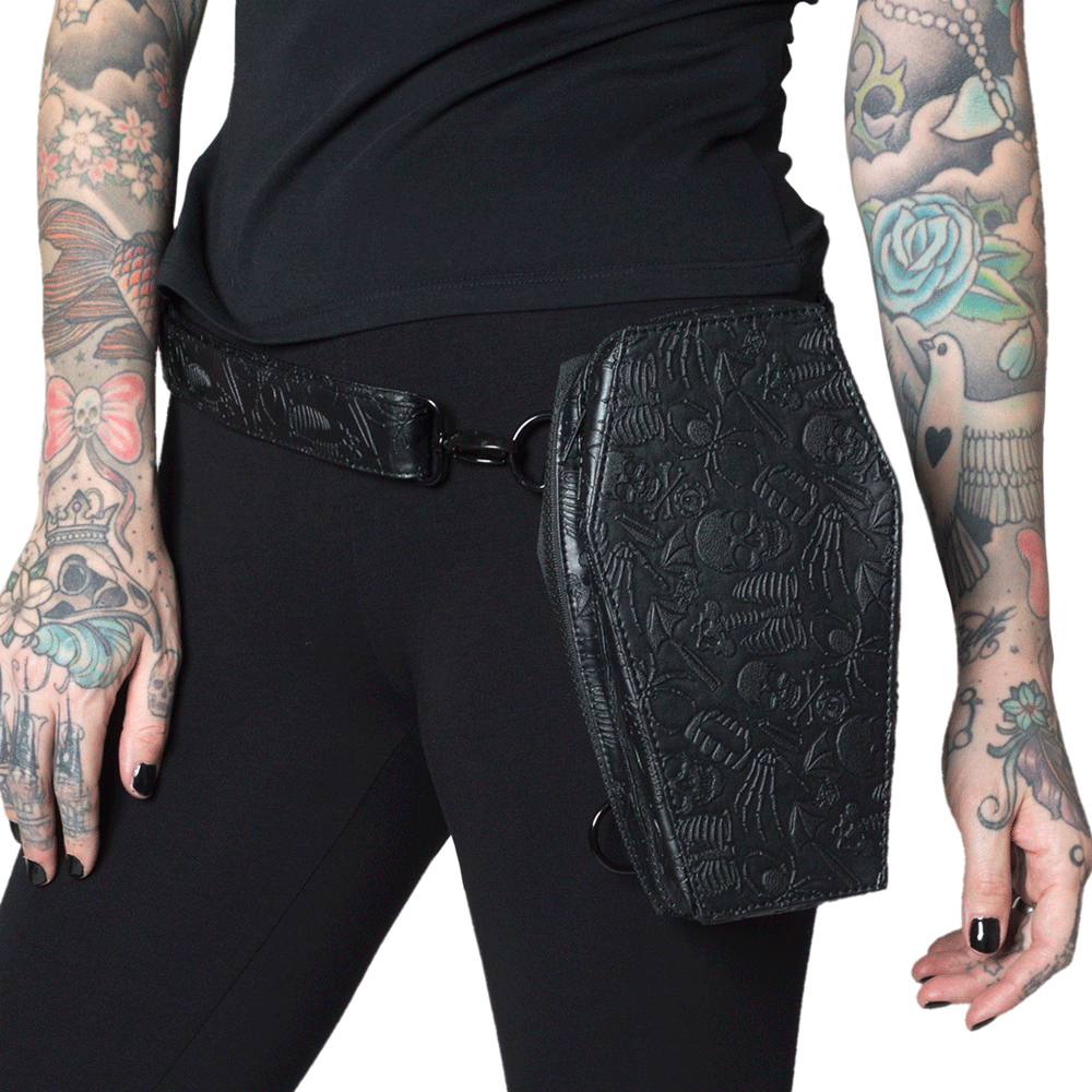 The coffin shaped hip pouch has an embossed design with skulls, skeletons, spiders, knives, bats, fangs, eyeballs and bones!