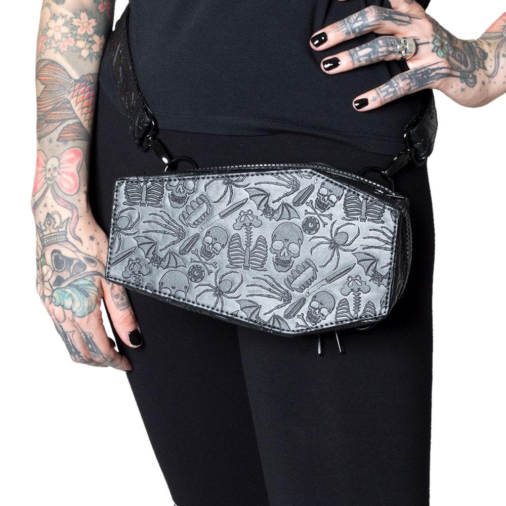 Our coffin-shaped bag can be worn as a belly bag as shown. The embossed design has skulls, skeletons, spiders, knives, bats, fangs, eyeballs and bones!