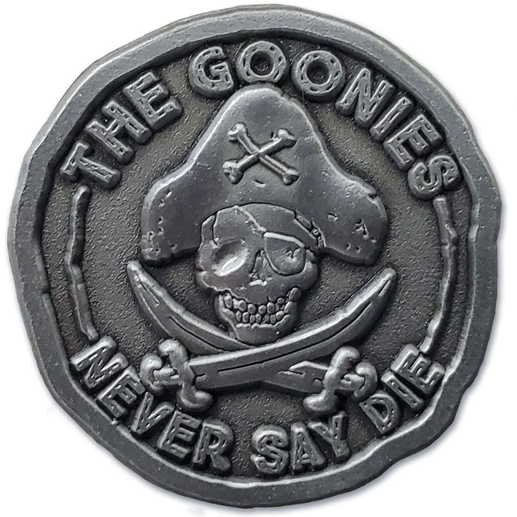Official Goonies Never Say Die enamel pin on backing card, pirate doubloon collectible pin, retro 80s movie gift for fans