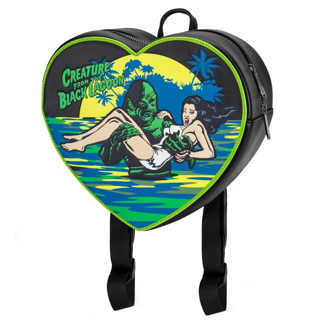 A heart-shaped black backpack featuring a colorful retro-style graphic of the Gillman holding a woman in water, with the text 'Creature from the Black Lagoon' on the front. The backpack has bright green piping and black shoulder straps, shown against a plain white background.
