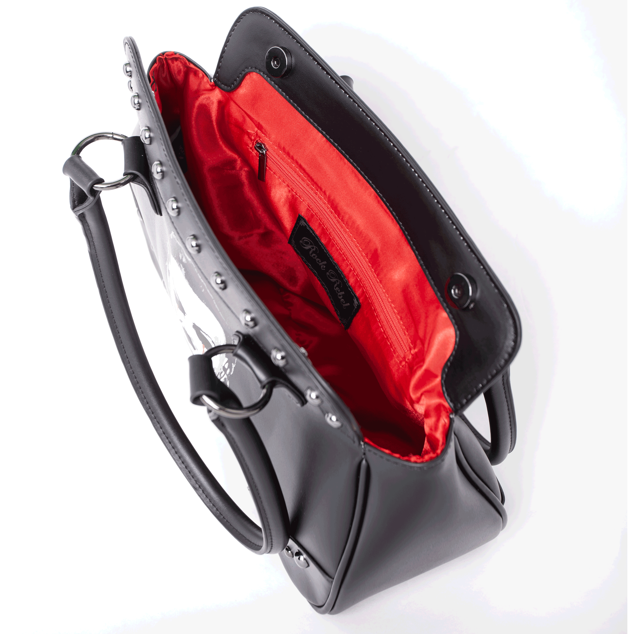 Interior view of Michael Myers purse showing red satin lining and zippered pocket with Rock Rebel logo tag