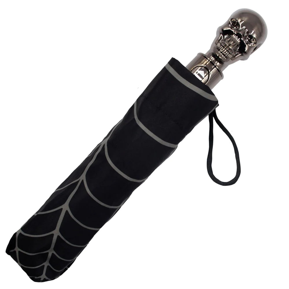 Spiderweb compact umbrella in travel case and skull handle is visible
