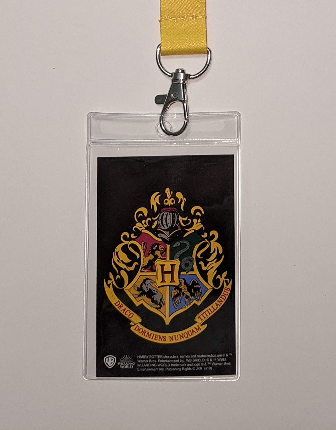 Closeup of the Hogwarts insert in the ID badge holder lanyard from the Harry Potter Bundle available at Nerd Imports.