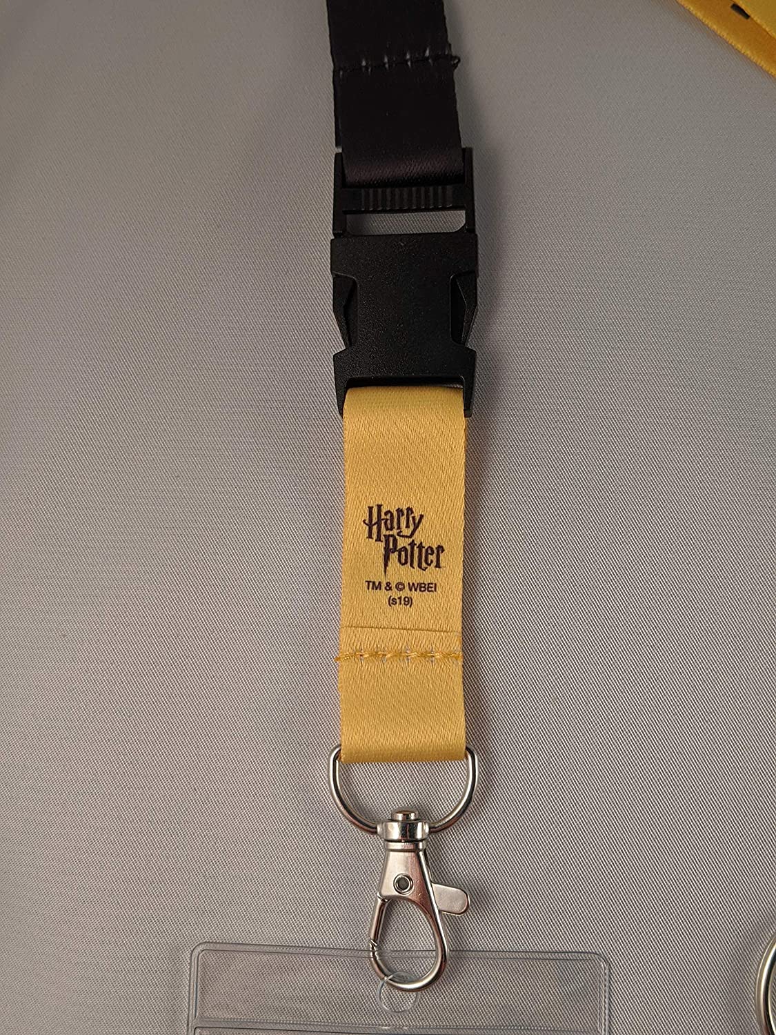 Closeup of the trademark printed on a lanyard from the Harry Potter Bundle available at Nerd Imports.