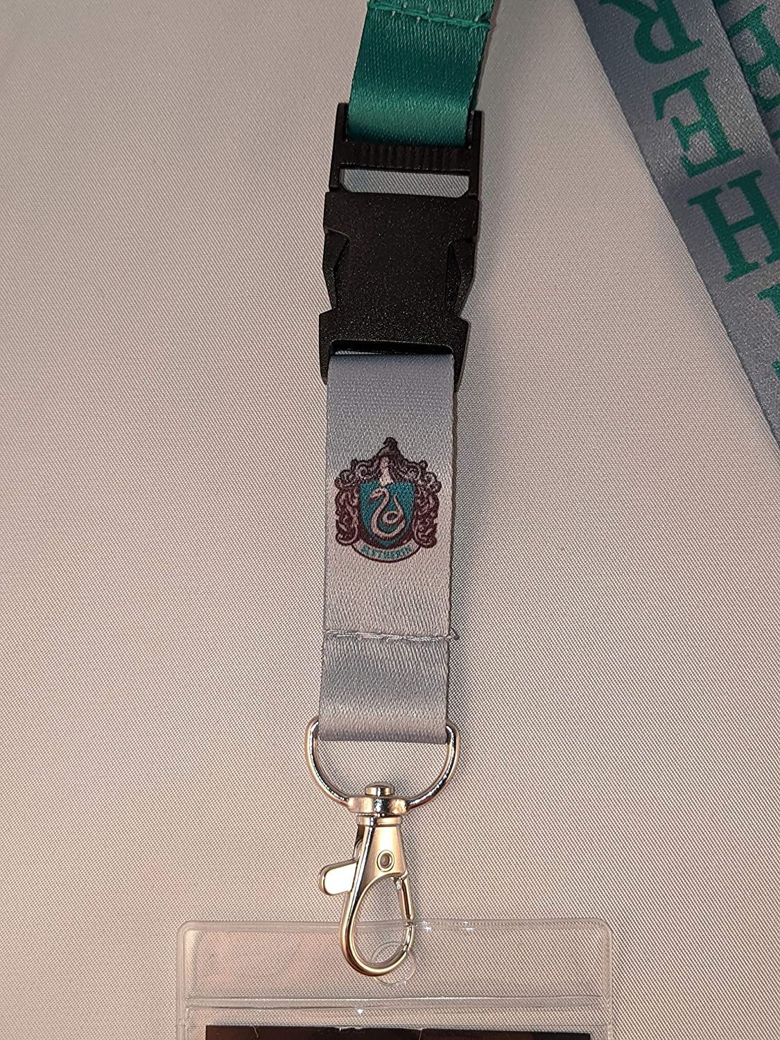 Closeup of the Slytherin lanyard from the Harry Potter Bundle available at Nerd Imports.